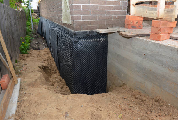 Happy homeowners after waterproofing job in Saint Charles
